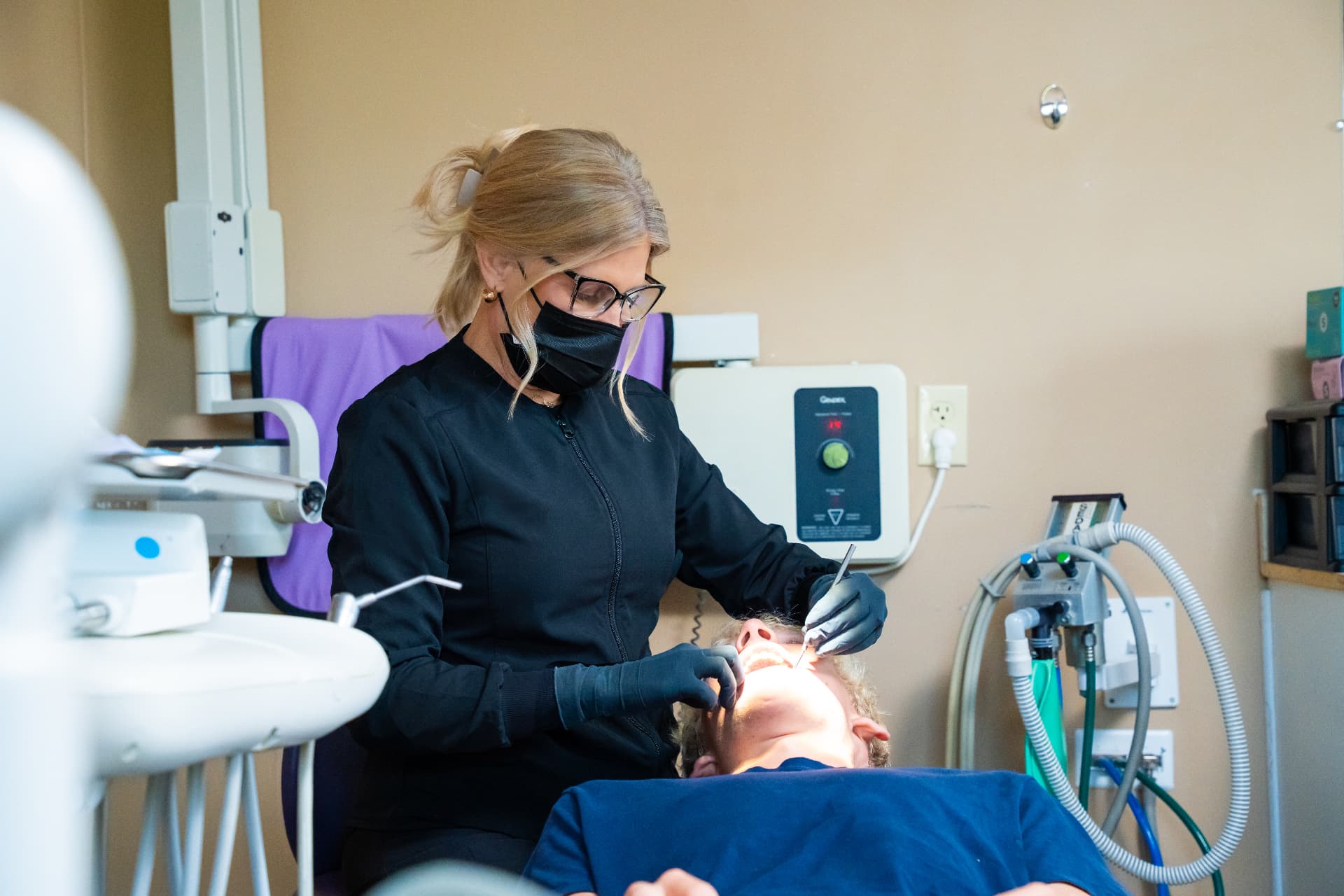 Dentist caring for a patient during treatment